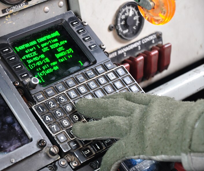 Capt. Tim Gerne, 351st Expeditionary Air Refueling Squadron, enters data into the Flight Management System on a KC-135 Stratotanker prior to a March 17, 2013, flight. The FMS is the aircraft’s computer that controls various aspects of each mission. (U.S. Air Force photo by Capt. Jason Smith)