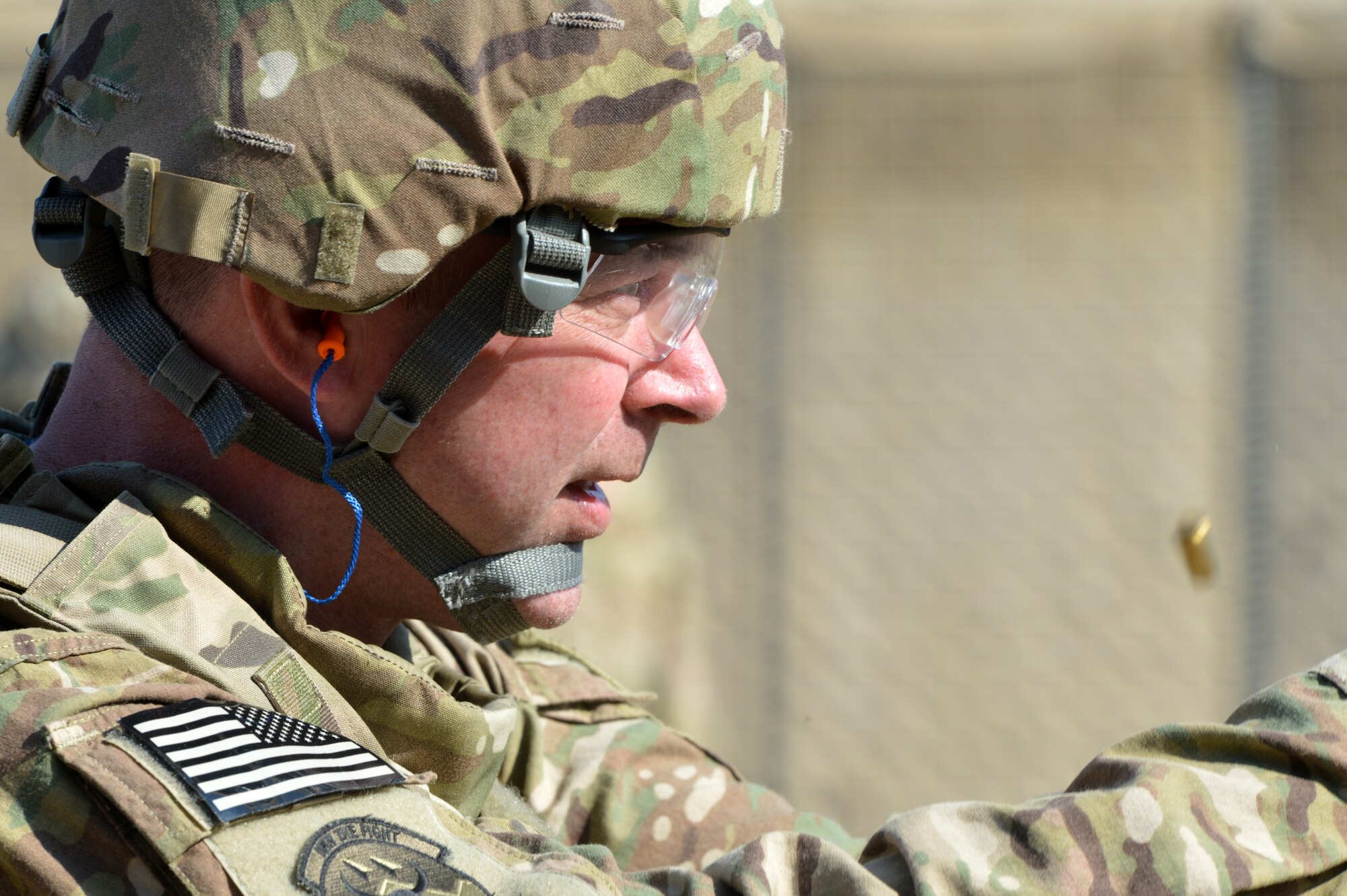 An Airman fires rounds during an “active shooter” training scenario on Bagram Airfield, Afghanistan, March 7, 2013.  During the course Airmen are told to fire starting from a seated position and also while moving towards the target.  (U.S. Air Force photo/Senior Airman Chris Willis)