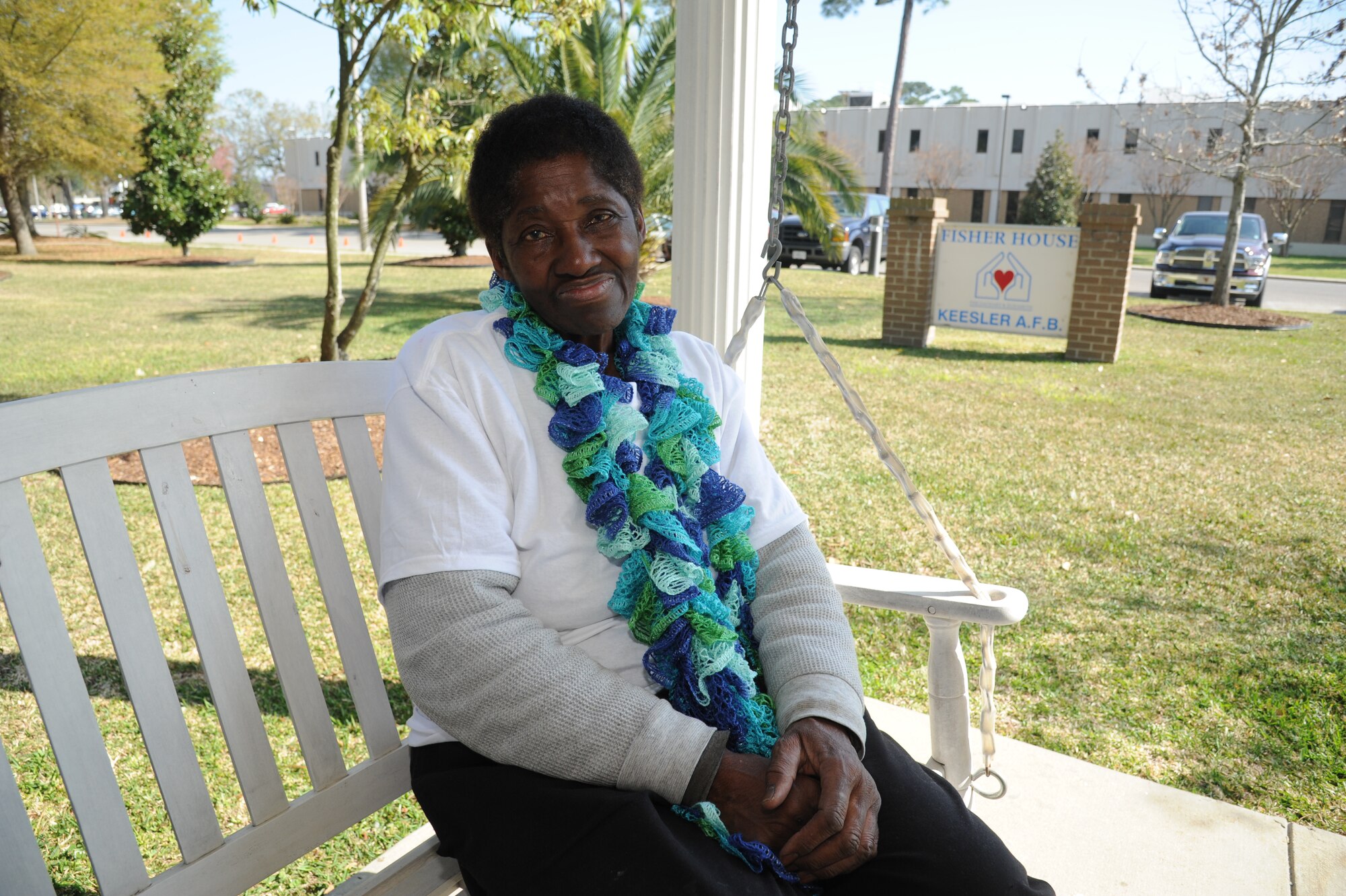 Mary Burley, housekeeper at Keesler Fisher House, relaxes for a moment on a porch swing of the Fisher House March 18, 2013, at Keesler Air Force Base, Miss.  The 72-year-old retires on March 29 with 45 years of service.  She spent 36 years at base lodging facilities and nine years as "lady of the house" at Fisher House.  (U.S. Air Force photo by Kemberly Groue)
