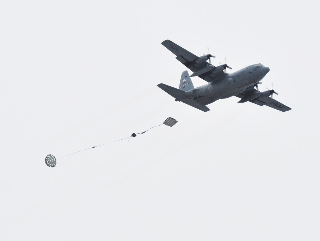 A C-130 Hercules aircraft from the 914th Airlift Wing drops heavy equipment loads during a training exercise March 2, 2013 at the Niagara Falls Air Reserve Station, N.Y.  (U.S. Air Force photo by Staff Sgt. Stephanie Clark)