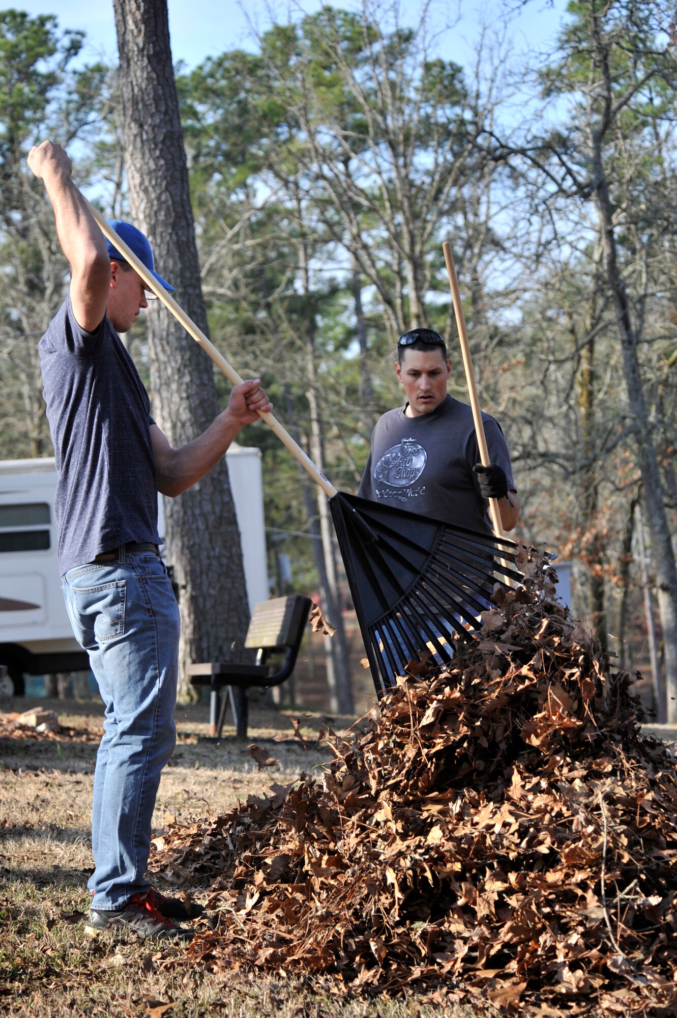 U.S. Air Force Airman 1st Class Christopher Beard and Tech. Sgt. Anthony Cathcart, 20th Logistics Readiness Squadron vehicle maintenance mechanics, rake leaves and debris during the fourth annual beautification day, at the Wateree Recreation Area, Camden, S.C., March 16, 2013. Beautification day began in 2010 after several winter storms flooded the property and left it littered with debris. (U.S. Air Force photo by Senior Airman Amber E. N. Jacobs/Released)