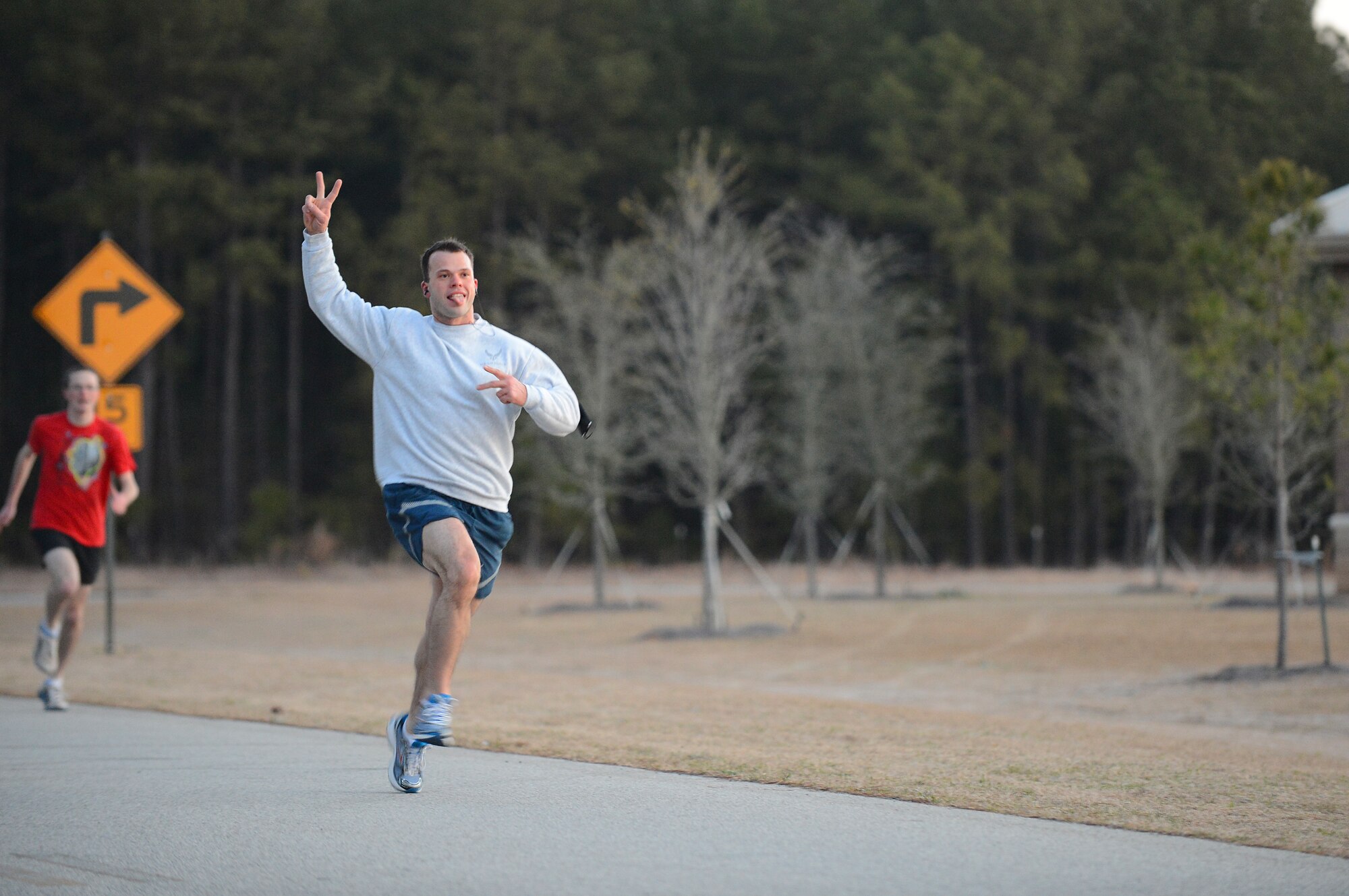 Airmen run during the annual St. Patrick's Day 5km run at Shaw Air Force Base, S.C., March 15, 2013. The 20th Force Support Squadron holds the annual 3-mile run, where service members are encouraged to show their spirit and wear green in celebration of the Irish holiday. More than 250 people attended the race.  (U.S. Air Force photo by Airman 1st Class Nicole Sikorski/Released)