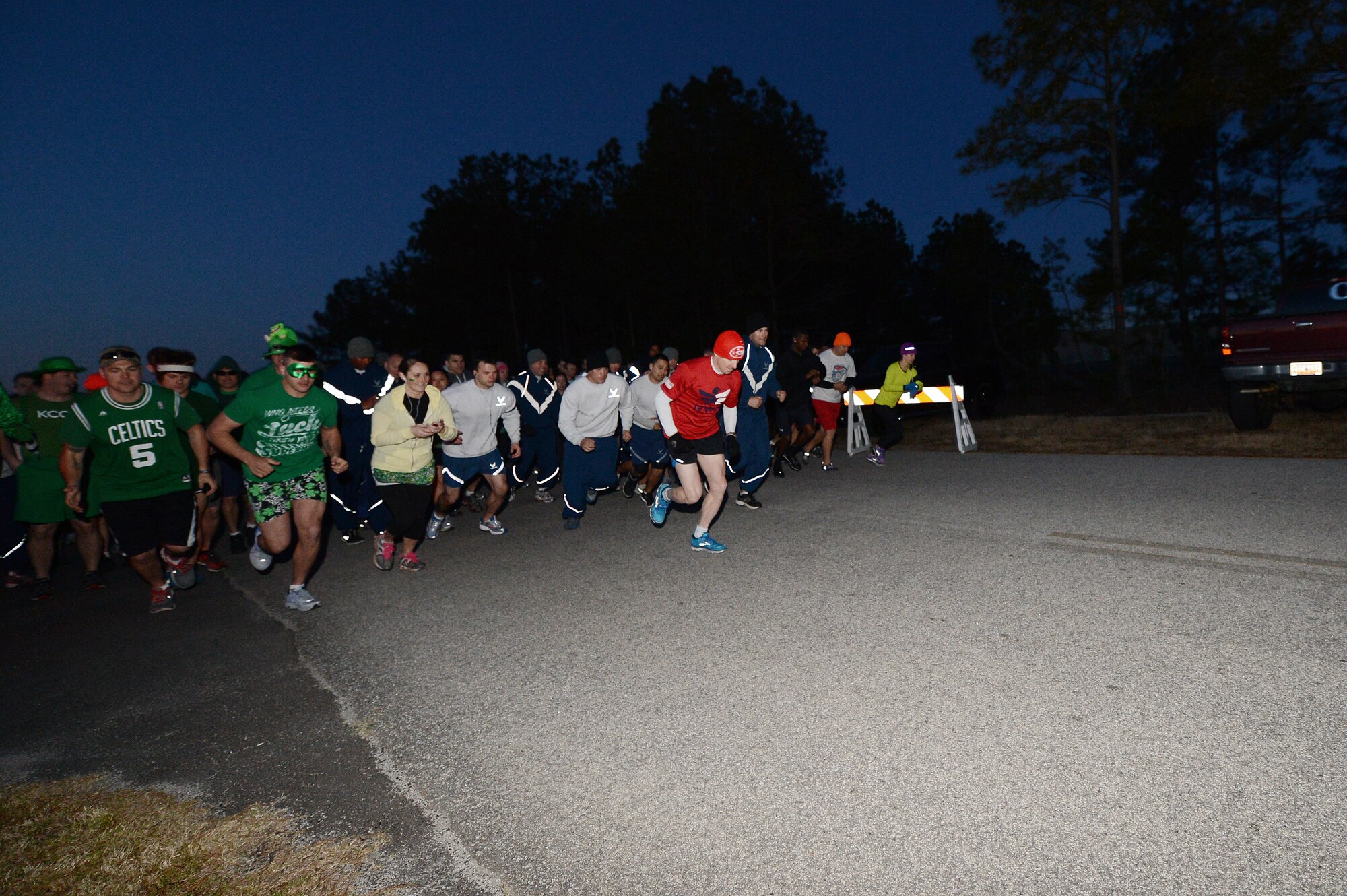 Airmen run during the annual St. Patrick's Day 5km run at Shaw Air Force Base, S.C., March 15, 2013. The 20th Force Support Squadron holds the annual 3-mile run, where service members are encouraged to show their spirit and wear green in celebration of the Irish holiday. More than 250 people attended the race.  (U.S. Air Force photo by Airman 1st Class Nicole Sikorski/Released)