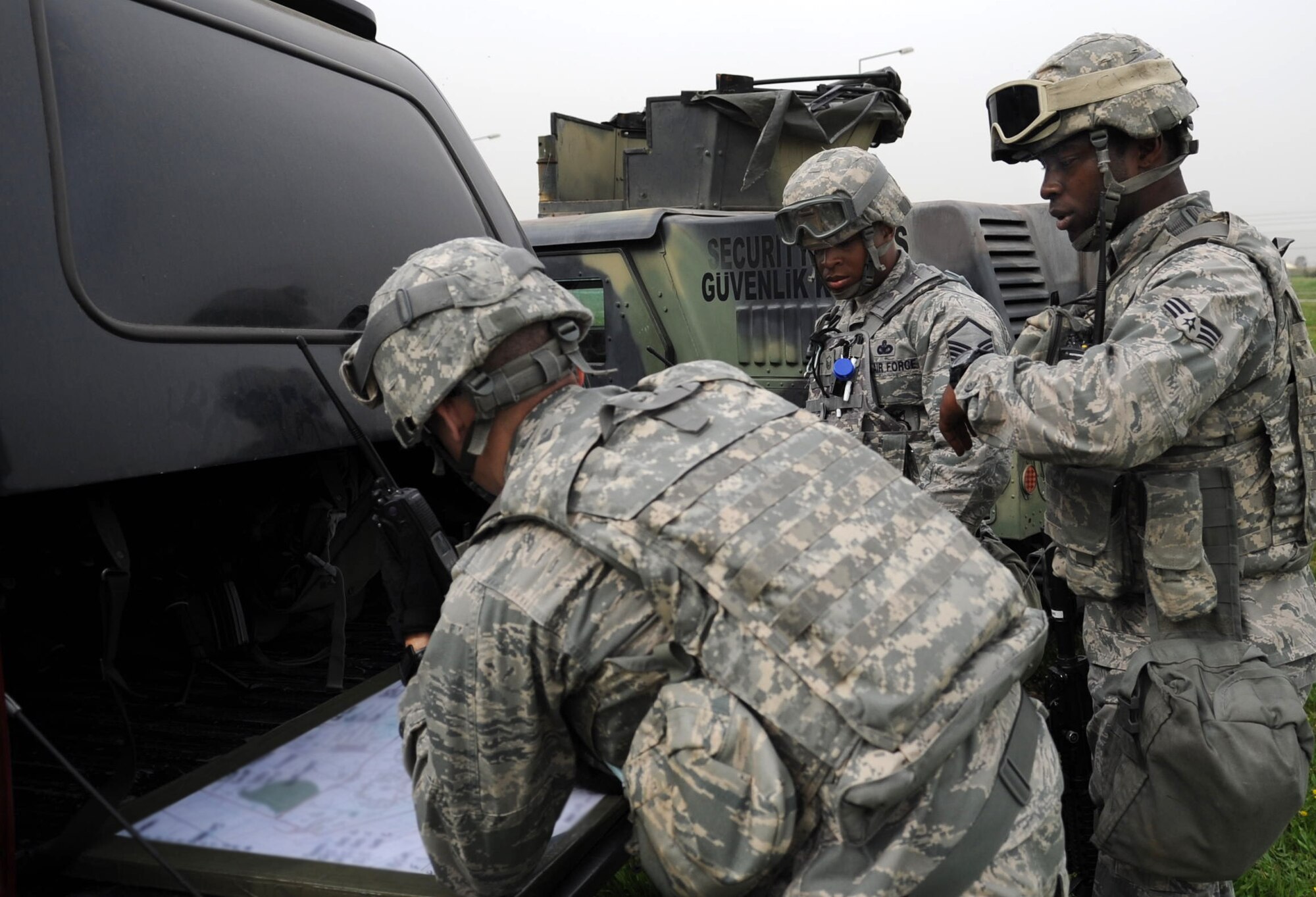 Members of the 39th Security Forces Squadron review a map during a base exercise March 14, 2013, at Incirlik Air Base, Turkey. Members of the 39th SFS train for a wide number of situations to include active shooter scenarios, security breaches and convoy training. (U.S. Air Force photo by Senior Airman Daniel Phelps/Released)