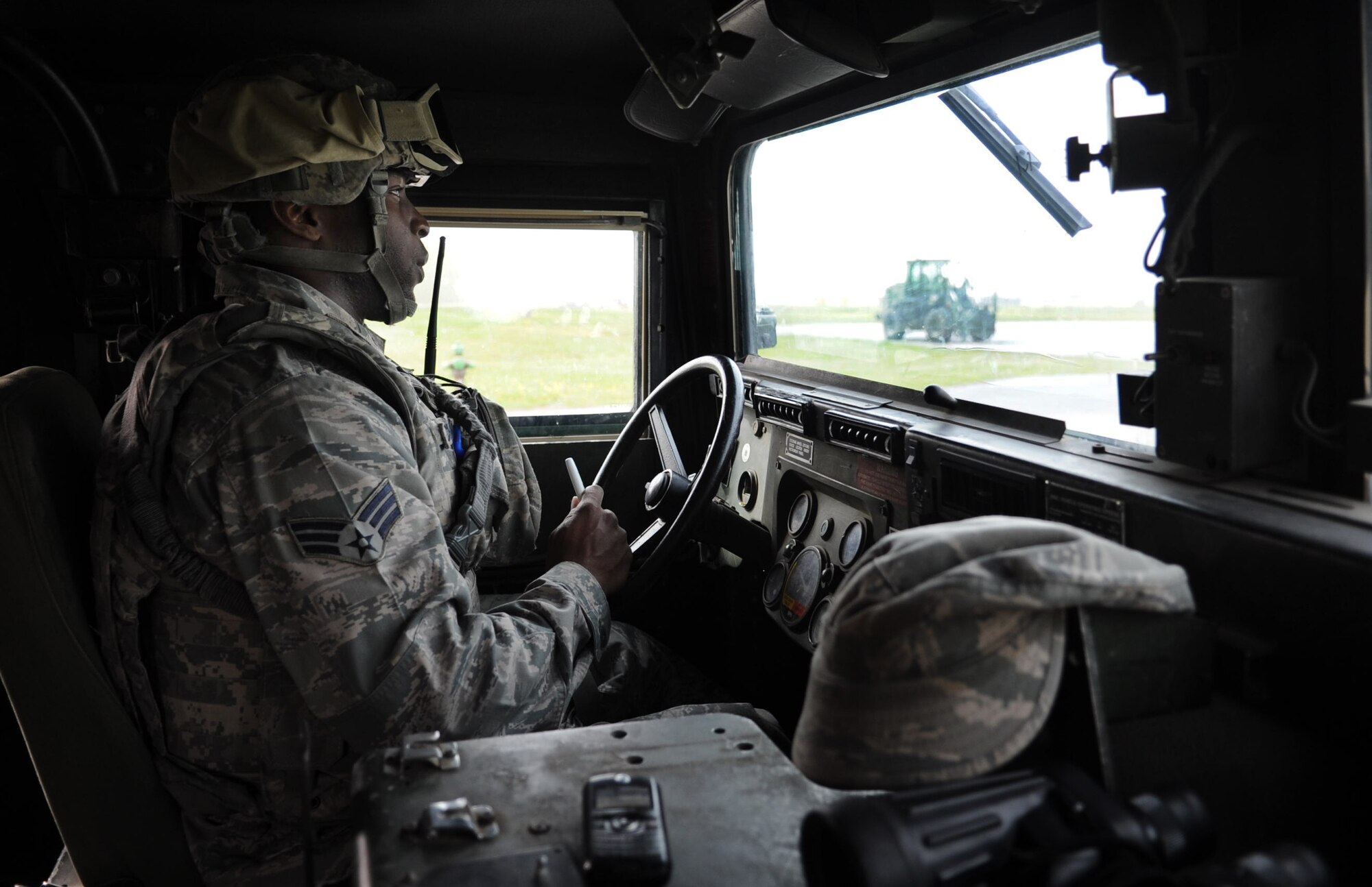 Senior Airman Kristen Chambliss, 39th Security Forces Squadron patrolman, patrols the area in a Humvee during a base exercise March 14, 2013, at Incirlik Air Base, Turkey. With the Patriot missile batteries here, the defenders ensure the areas with the Patriots are safe and secure. (U.S. Air Force photo by Senior Airman Daniel Phelps/Released)