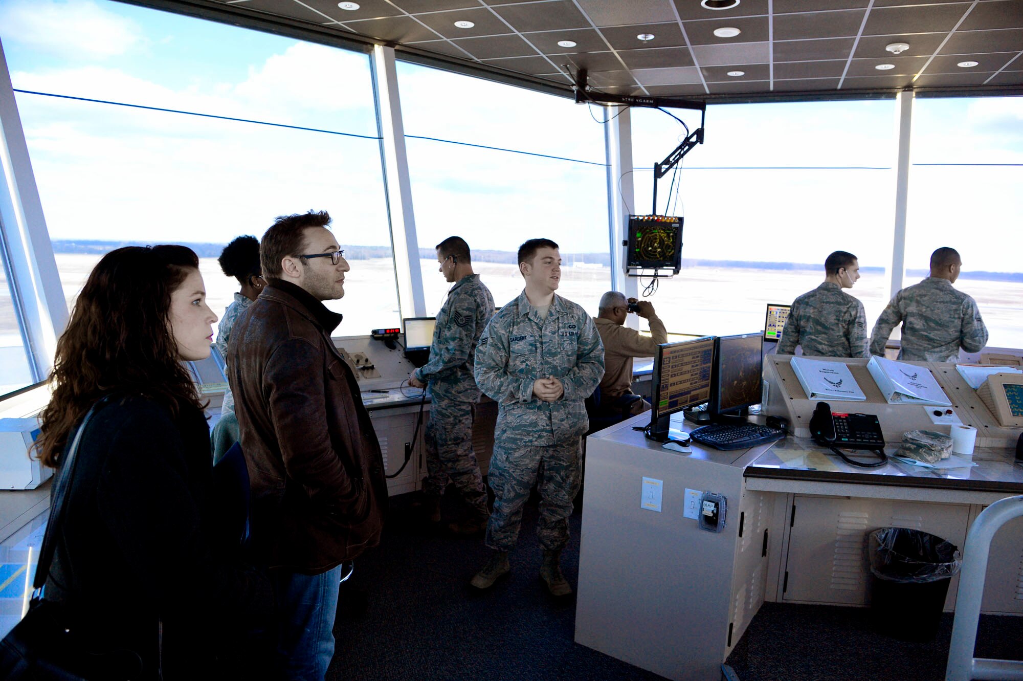 Simon Sinek, motivational speaker, tours the 436th Operations Support Squadron air traffic controller facilities March 14, 2013 at Dover Air Force Base, Del. (US Air Force photo/David S. Tucker)