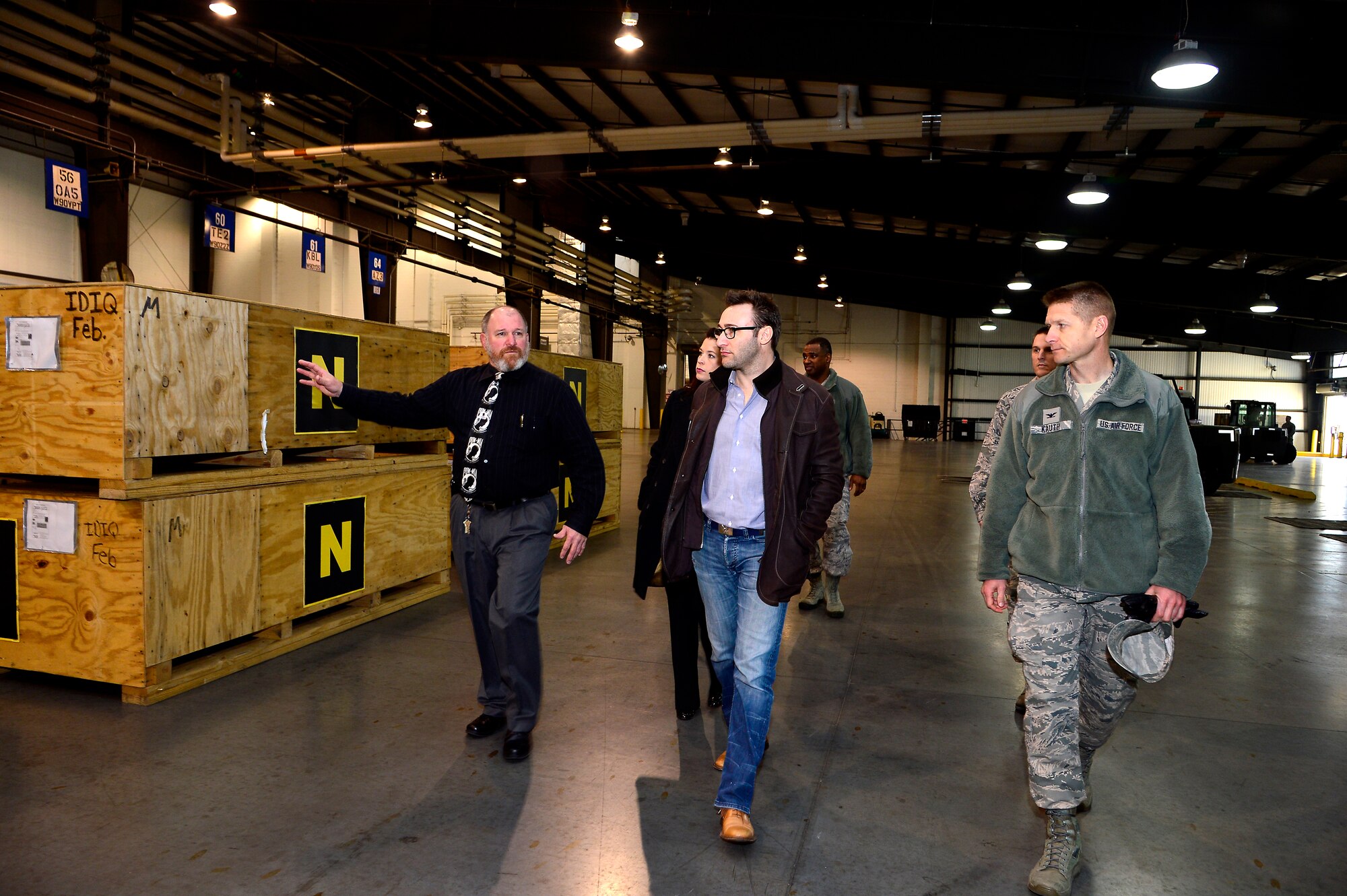 Simon Sinek (center), motivational speaker, tours the 436 Aerial Port Squadron facilities March 14, 2013 at Dover Air Force Base, Del. (US Air Force photo/David S. Tucker)