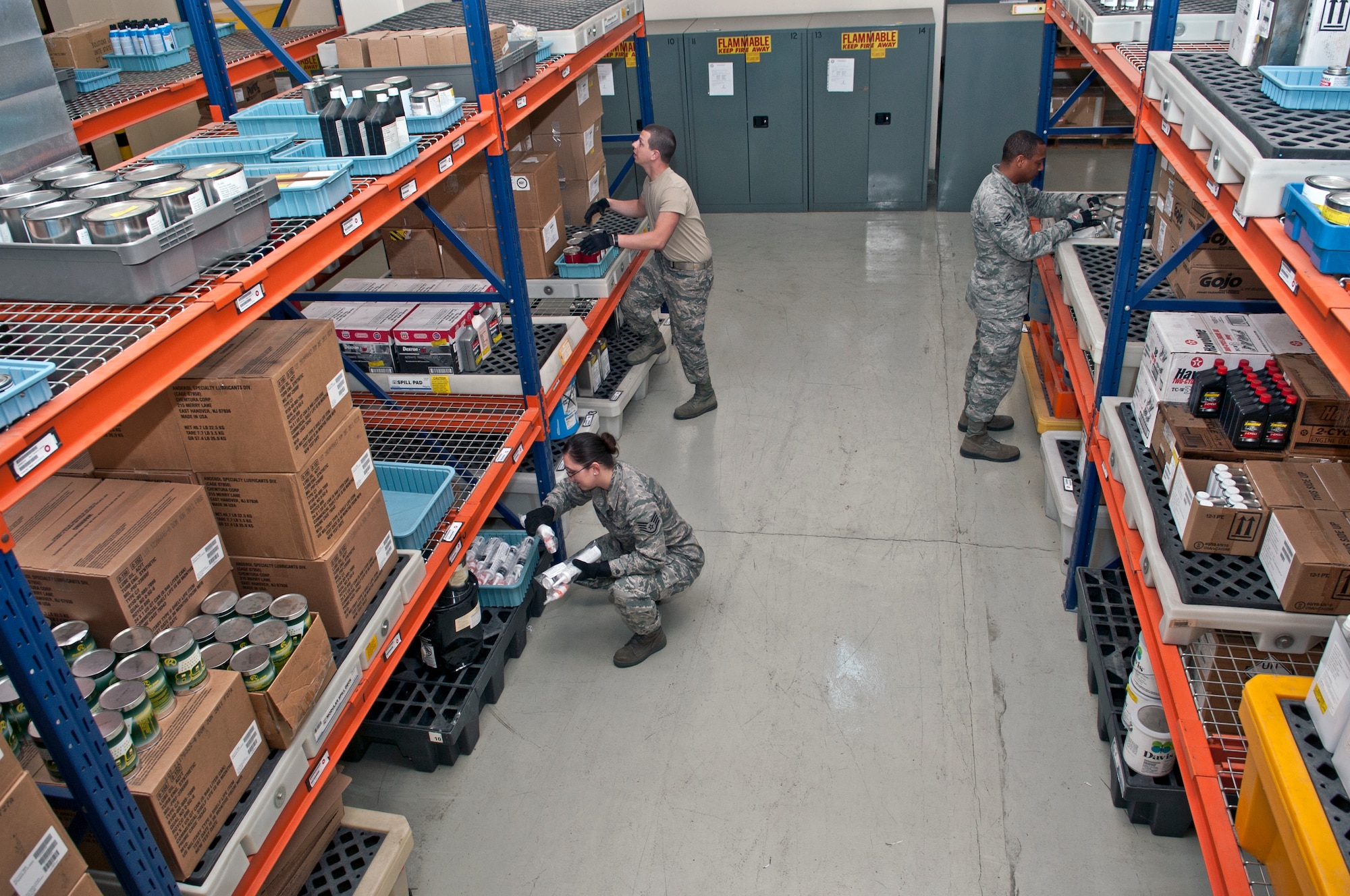Staff Sgt. Estella Gonzalez, 39th Logistics Readiness Squadron hazardous materials pharmacy technician, Airman 1st Class Michael Brown, 39th LRS HAZMAT pharmacy journeyman, and Airman 1st Class Lorenzo Lucas, 39th LRS HAZMAT pharmacy journeyman, search for supplies in the HAZMAT pharmacy warehouse March 14, 2013, at Incirlik Air Base, Turkey. The HAZMAT pharmacy is in charge of the issuing and maintenance of potentially hazardous materials on Incirlik. (U.S. Air Force photo by Senior Airman Daniel Phelps/Released)