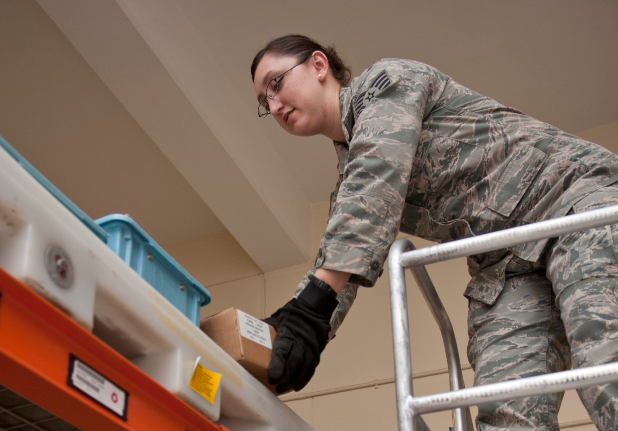 Staff Sgt. Estella Gonzalez, 39th Logistics Readiness Squadron hazardous materials pharmacy technician, gathers items for a customer from the 39th LRS HAZMAT warehouse March 14, 2013, at Incirlik Air Base, Turkey. Some of the materials supplied by the HAZMAT pharmacy are paint, vehicle oil, engine oil, hydraulic fluid, fire extinguishers and batteries. (U.S. Air Force photo by Senior Airman Daniel Phelps/Released)