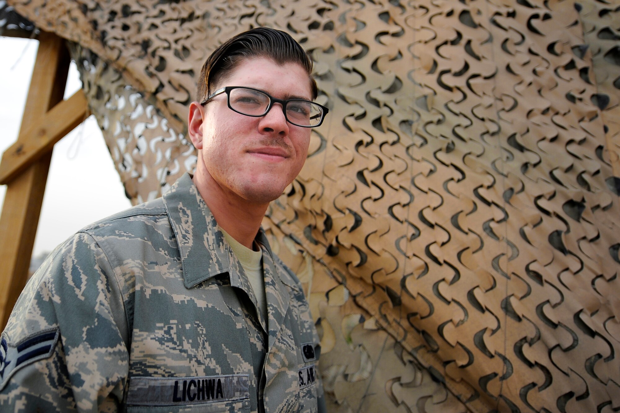 Airman 1st Class Daniel Lichwa, 387th Expeditionary Support Squadron, performs his duty of force protection at an undisclosed deployed location in Southwest Asia on March 18, 2013.  Lichwa was awarded this weeks “Rock Solid Warrior” designation by the 386 Air Expeditionary Wing.  This is Lichwa’s first deployment, and is further challenged with a duty outside of his career specialty.  “I deal with it by being open minded and willing to hear different ideas.  I joined the Air Force to do my part to serve my country.”   (U.S. Air Force photo by Staff Sgt. Austin Knox)