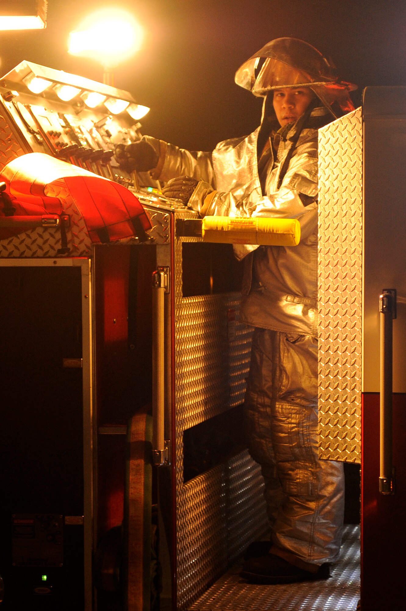 Senior Airman Christopher Reyes, 8th Civil Engineer Squadron firefighter, controls the pressure for fire hoses during exercise Beverly Midnight 13-2 at Kunsan Air Base, Republic of Korea, March 18, 2013. The scenario tested the firefighters’ skills to work together and rescue victims. (U.S. Air Force photo by Senior Airman Marcus Morris/Released)