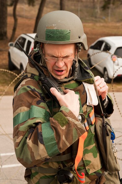 Tech. Sgt. David Harley, 8th Medical Support Squadron, calls in information about unexploded ordnance during a training scenario at Kunsan Air Base, Republic of Korea, March 19, 2013. The scenario was part of exercise Beverly Midnight 13-2 and was being used to evaluate 8th MDSS personnel’s’ ability to respond to various threats. (U.S. Air Force photo by Staff Sgt. Jonathan Fowler/Released)