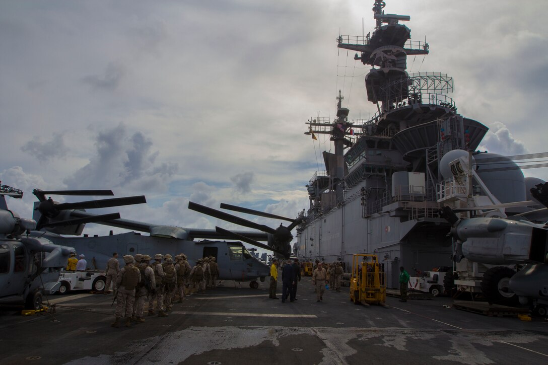 Marines and Sailors assigned to the 26th Marine Expeditionary Unit (MEU) maritime raid force fast rope aboard the USS Kearsarge (LHD 3) while at sea March 19, 2013. The 26th MEU is deploying to the 5th Fleet and 6th Fleet areas of operation. The MEU operates continuously across the globe, providing the president and unified combatant commanders with a forward-deployed, sea-based, quick-reaction force. The MEU is a Marine Air-Ground Task Force capable of conducting amphibious operations, crisis-response and limited contingency operations. (U.S. Marine Corps photo by Cpl. Kyle N. Runnels/Released)