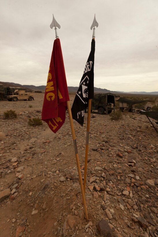 1st Battalion 4th Marines Alpha Company’s guidons posted during Exercise Steel Knight on Marine Corps Air-Ground Combat Center Twentynine Palms, Calif., Nov. 29, 2012. Exercise Steel Knight is an annual training exercise held to demonstrate the 1st Marine Division's abilities in a simulated combat scenario. (U.S. Marine Corps photo by Cpl. Jonathan R. Waldman/Released) 1st Battalion, 4th Marines — at Marine Corps Base, 29 Palms, CA.