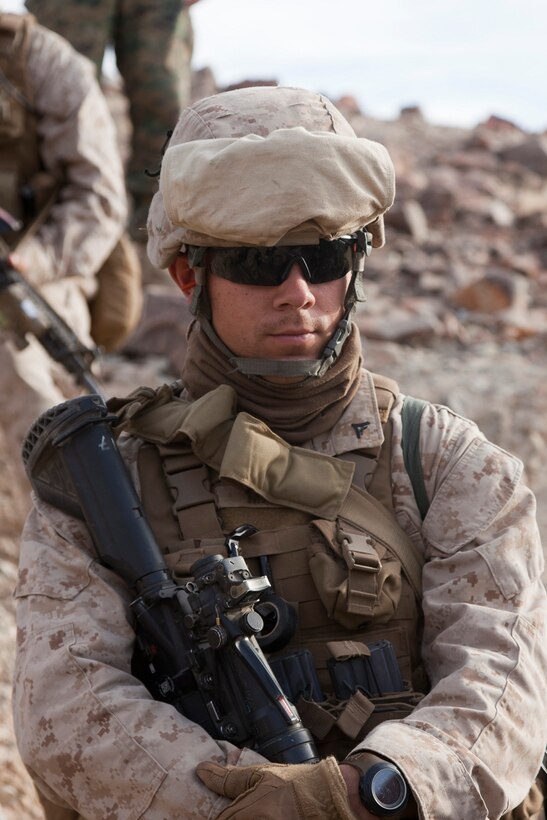 A lance corporal awaiting word during Exercise Steel Knight on Marine Corps Air-Ground Combat Center Twentynine Palms, Calif., Nov. 27, 2012. Exercise Steel Knight is an annual training exercise held to demonstrate the 1st Marine Division's abilities in a simulated combat scenario. (U.S. Marine Corps photo by Cpl. Jonathan R. Waldman/Released) 