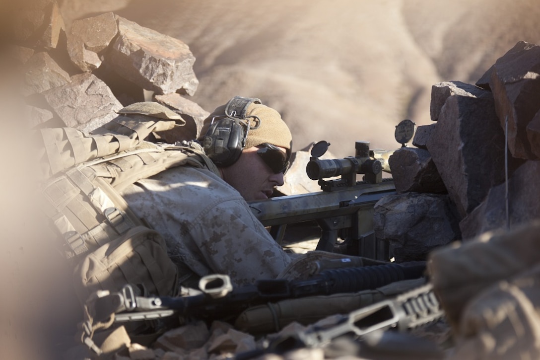 U.S. Marine Corps Lance Cpl. Kyle Janssen, assistant team leader with scout sniper team 1, scout sniper platoon, 1st Battalion, 4th Marines , 5th Marine Regiment, fires his XM107 Sniper Rifle during range 401 on Marine Corps Air Ground Combat Center Twentynine Palms, Calif., Dec. 4, 2012. Range 401 is a company maneuver and fire exercise held as part of Exercise Steel Knight. Exercise Steel Knight is an annual training exercise held to demonstrate the 1st Marine Division's abilities in a simulated combat scenario. (U.S. Marine Corps photo by Cpl. Jonathan R. Waldman/Released)