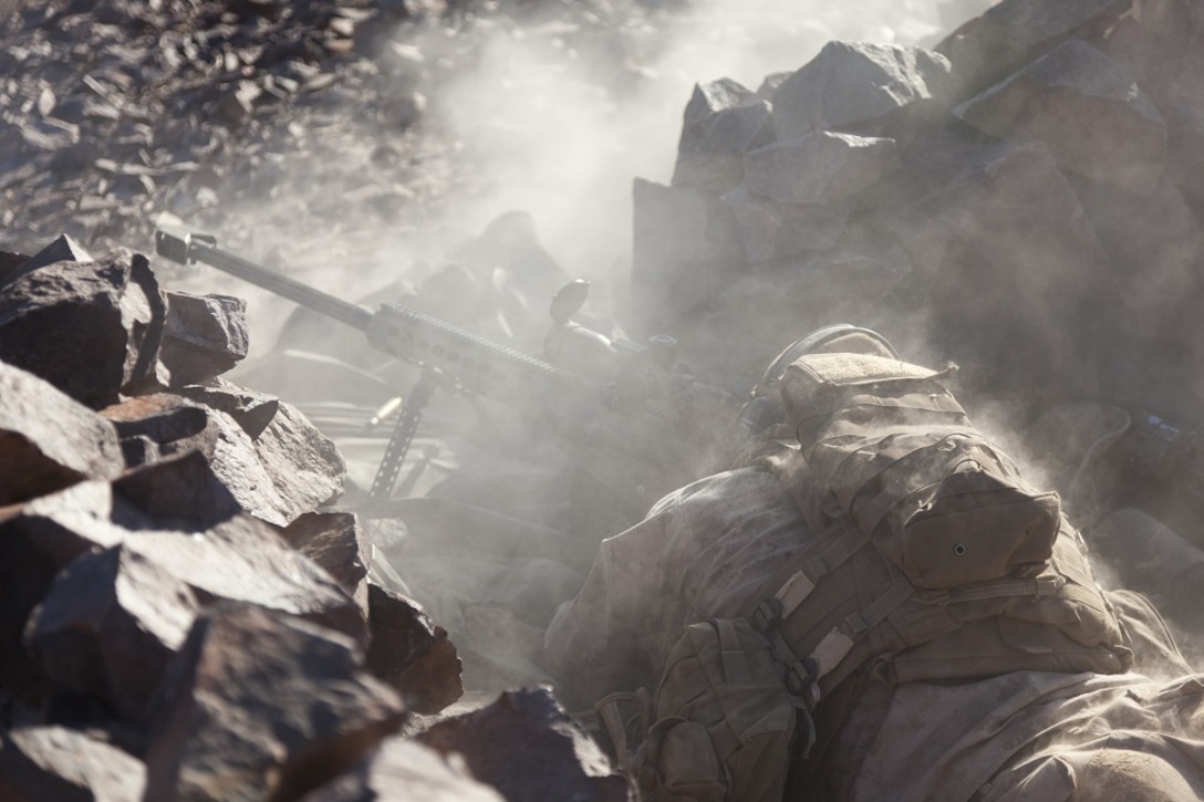 U.S. Marine Corps Lance Cpl. Kyle Janssen, assistant team leader with scout sniper team 1, scout sniper platoon, 1st Battalion, 4th Marines , 5th Marine Regiment, fires his XM107 Sniper Rifle during range 401 on Marine Corps Air Ground Combat Center  Twentynine Palms, Calif., Dec. 4, 2012. Range 401 is a company maneuver and fire exercise held as part of Exercise Steel Knight. Exercise Steel Knight is an annual training exercise held to demonstrate the 1st Marine Division's abilities in a simulated combat scenario. (U.S. Marine Corps photo by Cpl. Jonathan R. Waldman/Released)