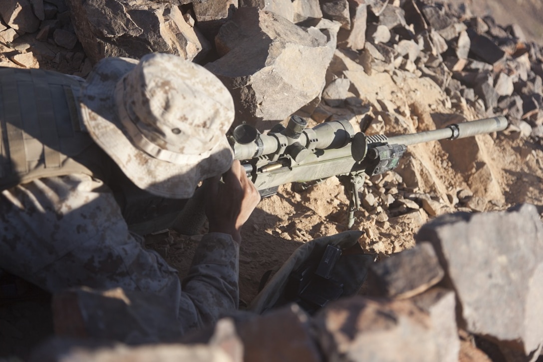 U.S. Marine Corps Sgt. Emmanuel Velayo, chief scout with scout sniper team 1, scout sniper platoon, 1st Battalion, 4th Marines, 5th Marine Regiment, cycles the bolt on his M40A5 Sniper Rifle during range 401 on Marine Corps Air Ground Combat Center  Twentynine Palms, Calif., Dec. 4, 2012. Range 401 is a company maneuver and fire exercise held as part of Exercise Steel Knight. Exercise Steel Knight is an annual training exercise held to demonstrate the 1st Marine Division's abilities in a simulated combat scenario. (U.S. Marine Corps photo by Cpl. Jonathan R. Waldman/Released)