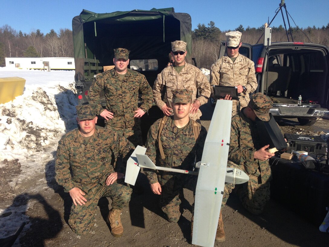 A group of Marines from Headquarters Company, 25th Marine Regiment, and 1st Battalion, 25th Marine Regiment, take a break during a UAV training exercise here, March 9. From left to right – Staff Sgt. Ryan D. Cherhoniak, a radio chief for 25th Marine Regiment; Lance Cpl. Michael A. Santoro Jr., an intelligence specialist with Headquarters and Service Co., 1/25; Lance Cpl. Michael F. Kieloch, an infantryman with Headquarters and Service Co.  1/25; Lance Cpl. Justin M. Cotton, a motor transport operator with Headquarters Co., 25th Marine Regiment; Cpl. Lincoln T. Weiss, a chemical, biological, radiological and nuclear specialist with Headquarters Co., 25th Marine Regiment; and Sgt. Nicholas J. Cunningham, a Marine Air-Ground Task Force planner with Headquarters Co., 25th Marine Regiment. 