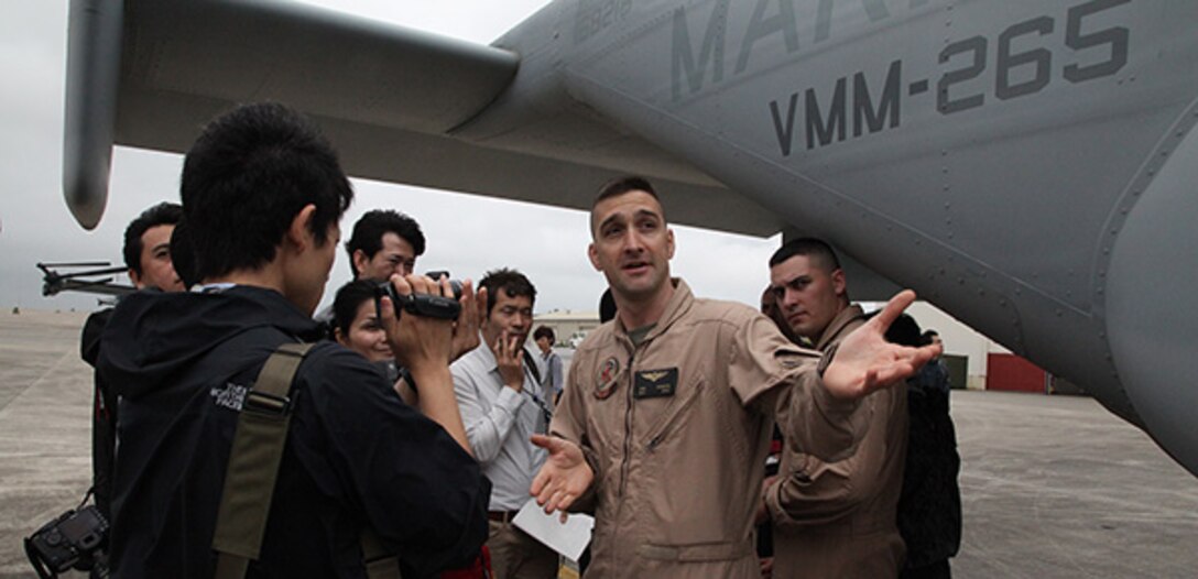 Maj. Stephen M. Pirrotta explains the capabilities of the MV-22 Osprey during the orientation event, aboard Marine Corps Air Station Futenma, Japan, March 20. The orientation event was to learn about the safety, capabilities and operation of the MV-22B Osprey aircraft. Basing the Osprey in Okinawa significantly strengthens the United States' ability to provide for the defense of Japan, perform humanitarian assistance and disaster relief operations, enhancing the U.S.-Japan Security Alliance. 