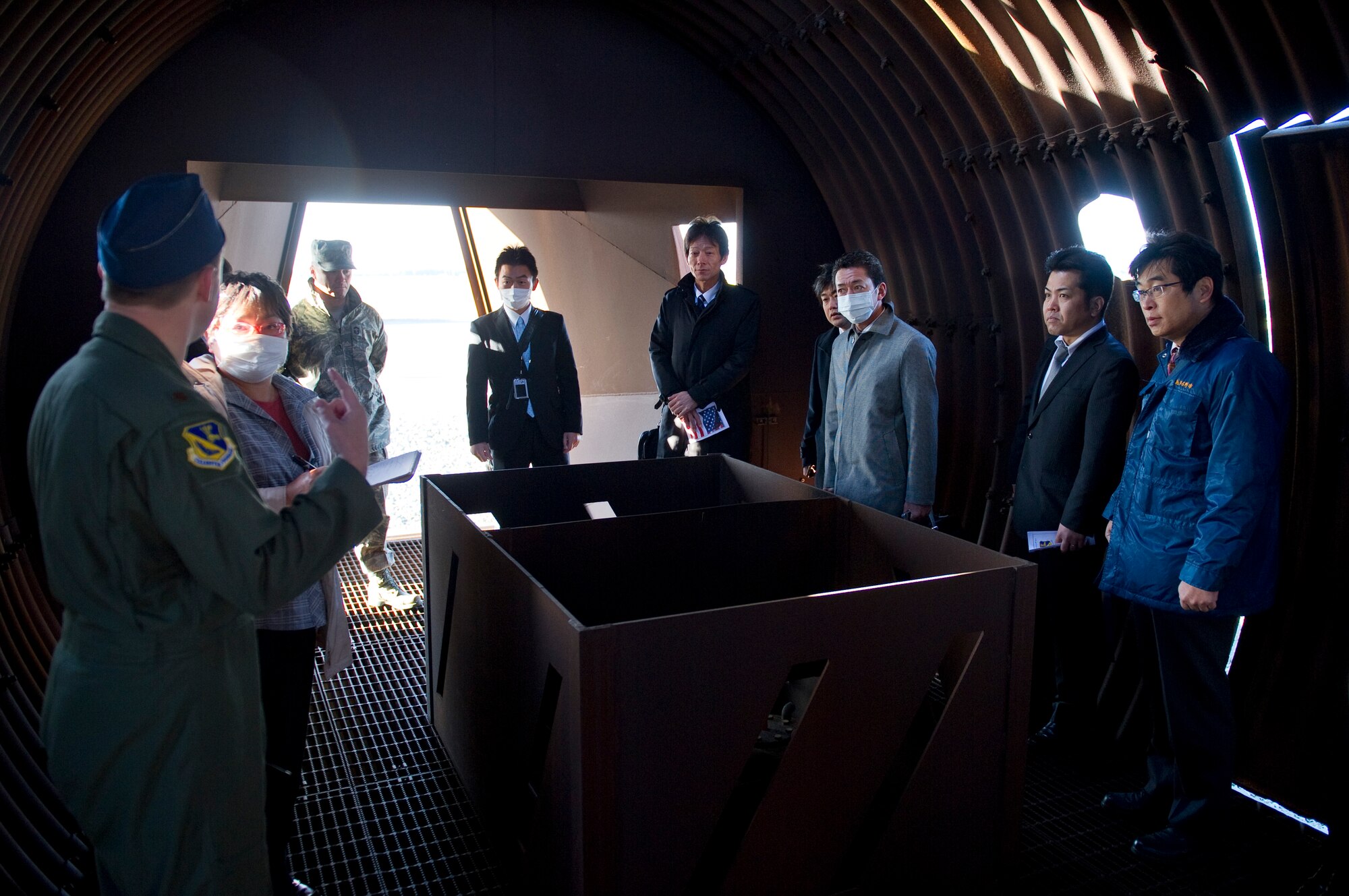 YOKOTA AIR BASE, Japan -- Maj. Yancey Walker, 374th Airlift Wing exercises and inspections chief, gives North Kanto Defense Bureau liaisons a tour of the inside of a simulated aircraft used for live-fire exercises at Yokota Air Base, Japan, Mar. 21, 2013. The liaisons came on base to observe how Yokota first responders react to a crisis. (U.S. Air Force photo by SSgt Chad C. Strohmeyer)