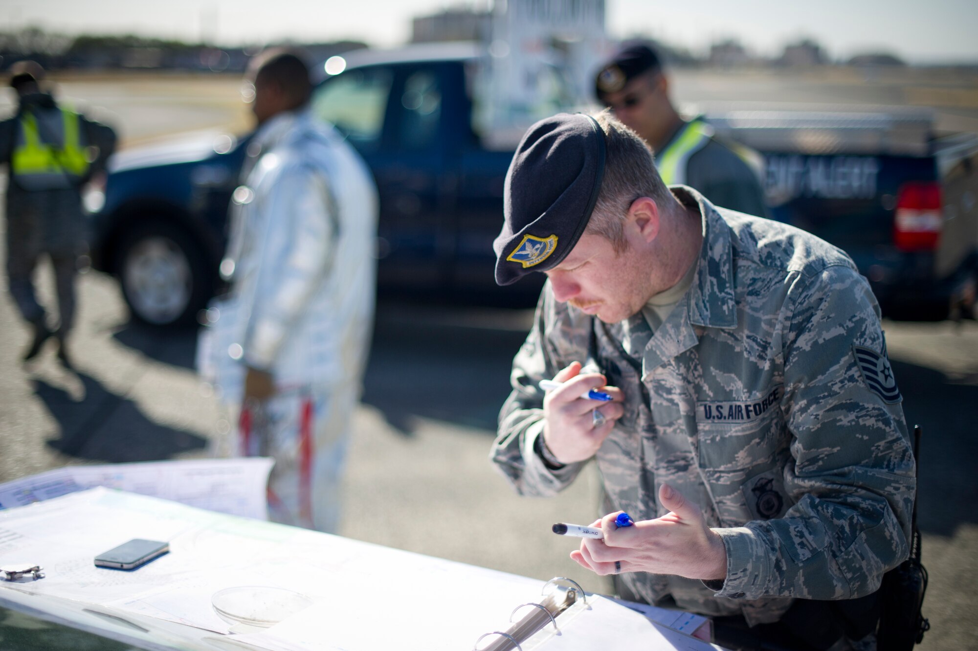 YOKOTA AIR BASE, Japan -- Tech. Sgt. Charles Salton, 374th Security Forces Squadron, set up the entry control point during a joint emergency management exercise at Yokota Air Base, Japan, March 21, 2013. Security Forces sets up control points to ensure the accident scene is kept safe and secure. (U.S. Air Force photo by Staff Sgt Stacy Moless)