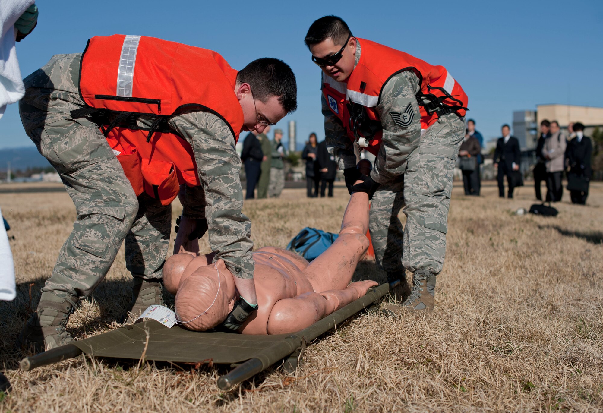 YOKOTA AIR BASE -- Responders lift a simulated victim onto a litter, March 21, 2013.  The exercise was held to strengthen Yokota's joint operations with Japanese response teams. (U.S. Air Force photo by Airman 1st Class Meagan Schutter)