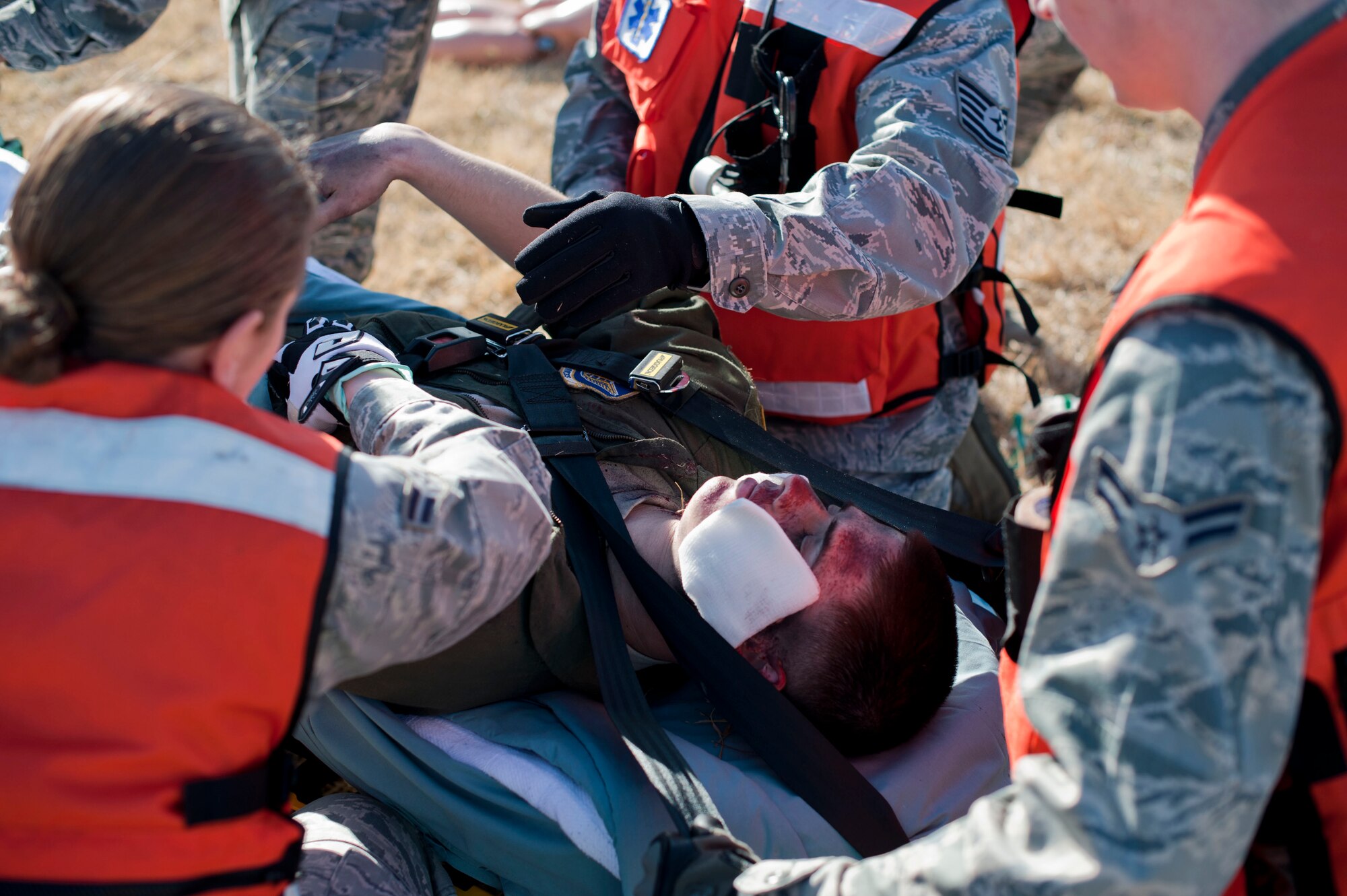 YOKOTA AIR BASE -- Airman 1st Class Paul Hensley, 36th Airlift Squadron Loadmaster, acts as a victim during an exercise, March 21, 2013.  Responders were quick to act during the mass causality exercise. (U.S. photo by Airman 1st Class Meagan Schutter)
