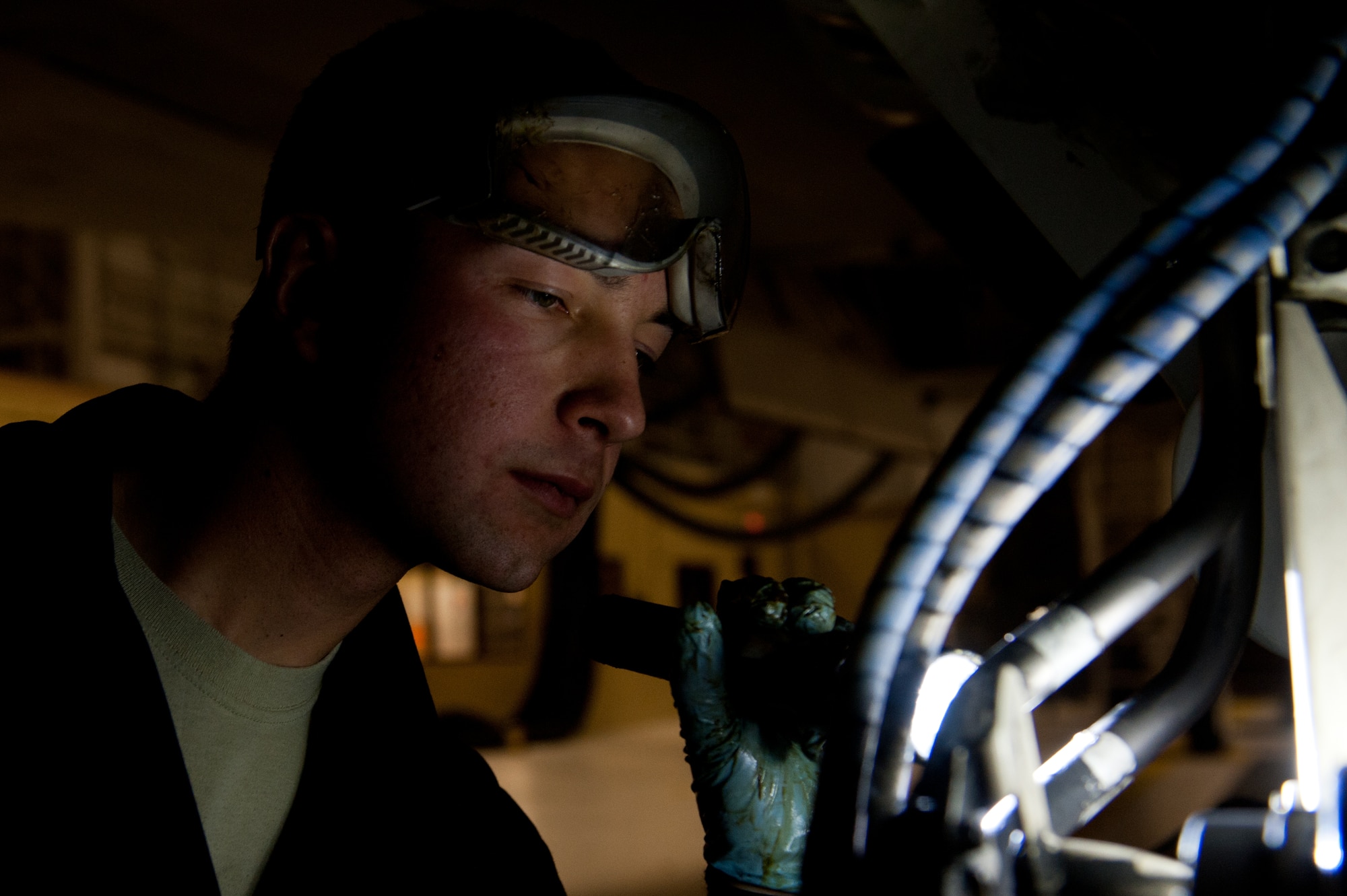 Airman 1st Class Justin Hollis, 28th Aircraft Maintenance Squadron B-1 crew chief, performs a post wash inspection of a B-1 during an Operational Readiness Exercise at Ellsworth Air Force Base, S.D., March 20, 2013. OREs consist of various scenarios to test Airmen’s capability to deploy quickly in response to real-world contingency operations. (U.S. Air Force photo by Airman 1st Class Kate Thornton-Maurer/Released) 