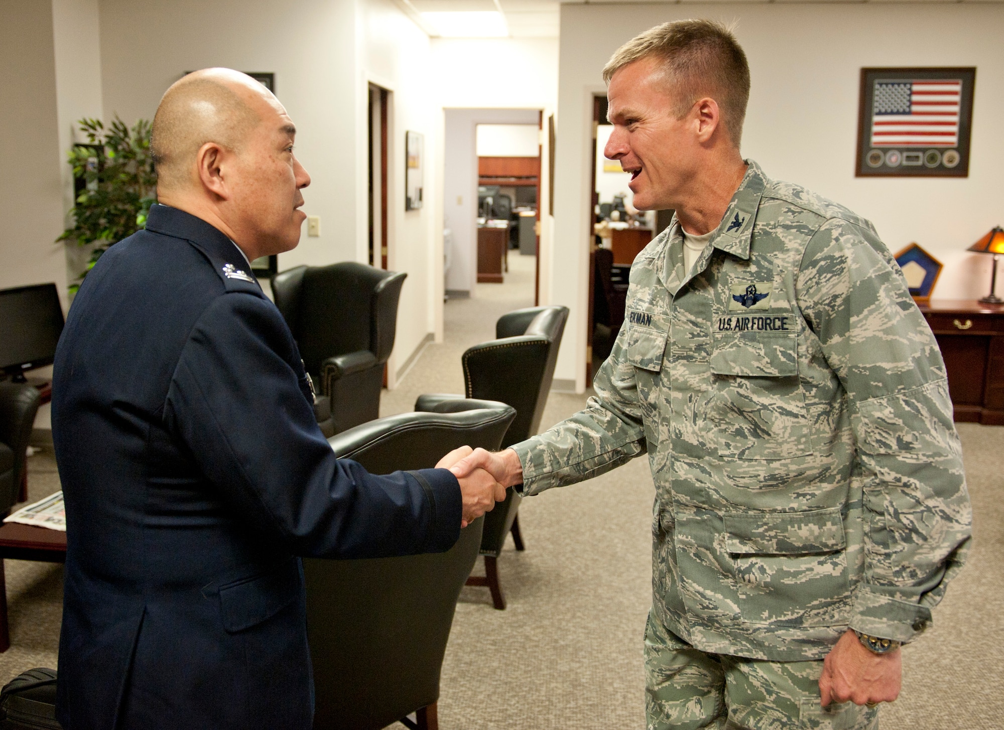 Colonel Kenneth Ekman, 49th Wing vice commander, welcomes Col. Junichi Kono, 2nd Section Weapons System Program Division chief, to Holloman Air Force Base, N.M., March 19. The Remotely Piloted Aircraft program was briefed to the members of the Japan Air Self Defense Force. Their visit to Holloman AFB was part of an effort to bolster Japanese intelligence, surveillance and reconnaissance capability. (U.S. Air Force photo by Airman 1st Class Colin Cates/Released) 