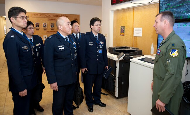 U.S. Air Force Lt. Col. Jeffery Patton, 9th Attack Squadron commander, welcomes members of the Japan Air Self Defense Force to Holloman Air Force Base, N.M., March 19. The remotely piloted aircraft program was briefed to the members of the Japan Air Self Defense Force. Their visit to Holloman AFB was part of an effort to bolster Japanese intelligence, surveillance and reconnaissance capability. (U.S. Air Force photo by Airman 1st Class Colin Cates/Released) 

