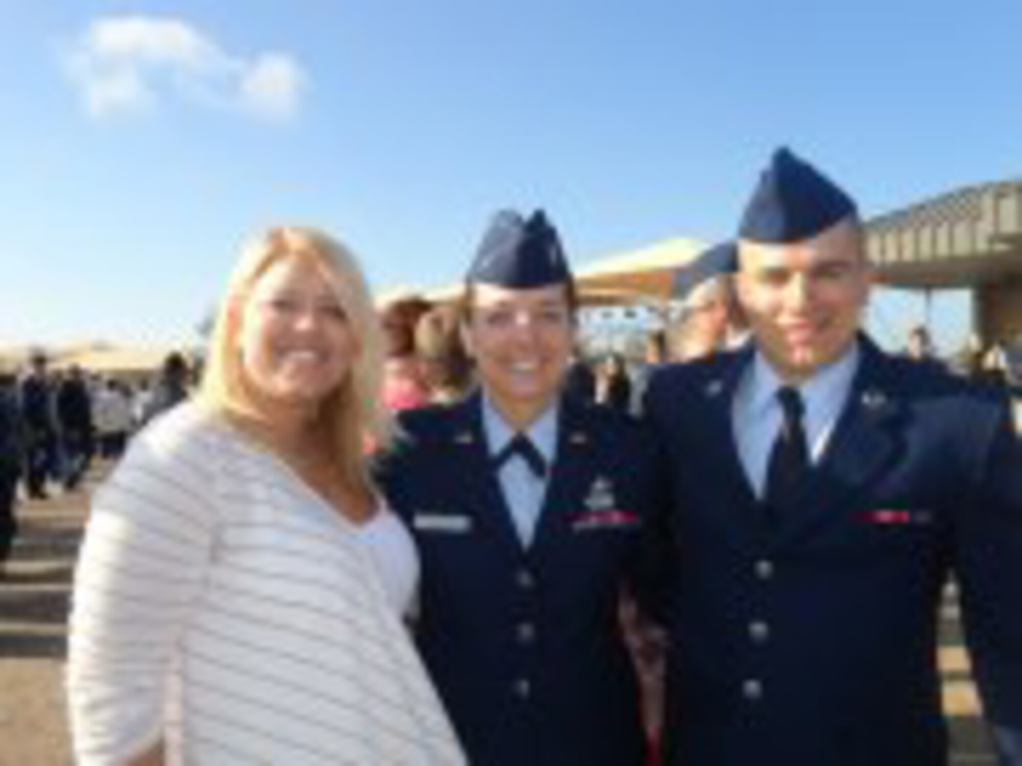 JBSA-SAN ANTONIO -- 2nd Lt. Kaylee Ausbun, 30th Space Wing Public Affairs deputy chief, stands with her older sister, Anna, and her younger brother, Amn. Caleb Hay on the parade grounds here Friday, March 15, 2013. Ausbun and her family spent the weekend in San Antonio celebrating Airman Hay's graduation. (U.S. Air Force by/ 2nd Lt. Kaylee Ausbun)
