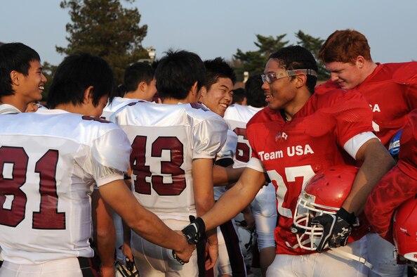 Team USA and Team Kanto players shake hands following the 2013 Tomodachi Bowl March 10, 2013, Yokota Air Base, Japan. (U.S. Air Force photo/Airman 1st Class Desiree Economides) 

