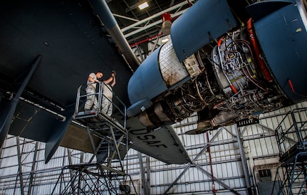 Airman 1st Class Michael Ficken (left), 437th Maintenance Squadron Aircraft Electrical and Environmental Systems specialist, and Senior Airman Paul Wilhems, 315th MXS ELEN specialist, perform a routine maintenance check on a C-17 Globemaster III fire extinguishing system March 18, 2013, at Joint Base Charleston – Air Base, S.C. The fire bottles release an extinguishing agent into the engines of the C-17 in case of an in-flight emergency. Airmen and civilians from the 437th MXS ELEN shop perform maintenance on lighting equipment, motors, batteries, anti-icing controllers, caution and warning panels and many other parts. (U.S. Air Force photo / Airman 1st Class Tom Brading)