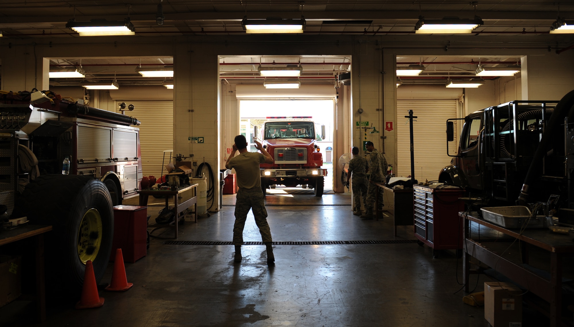 Airman 1st Class Timothy Bailey, 2nd Logistics Readiness Squadron Firetruck and Refueling Maintenance Section, directs a rescue truck into a garage on Barksdale Air Force Base, La., March 20. Because of their importance to the mission, firetrucks require maintenance from Airmen who specialize in maintaining them. (U.S. Air Force photo/Airman 1st Class Benjamin Gonsier)