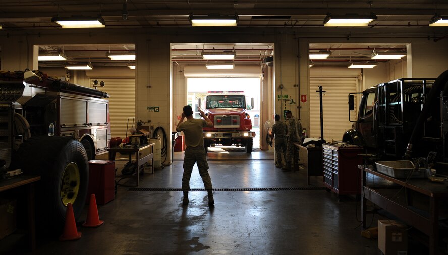 Airman 1st Class Timothy Bailey, 2nd Logistics Readiness Squadron Firetruck and Refueling Maintenance Section, directs a rescue truck into a garage on Barksdale Air Force Base, La., March 20. Because of their importance to the mission, firetrucks require maintenance from Airmen who specialize in maintaining them. (U.S. Air Force photo/Airman 1st Class Benjamin Gonsier)