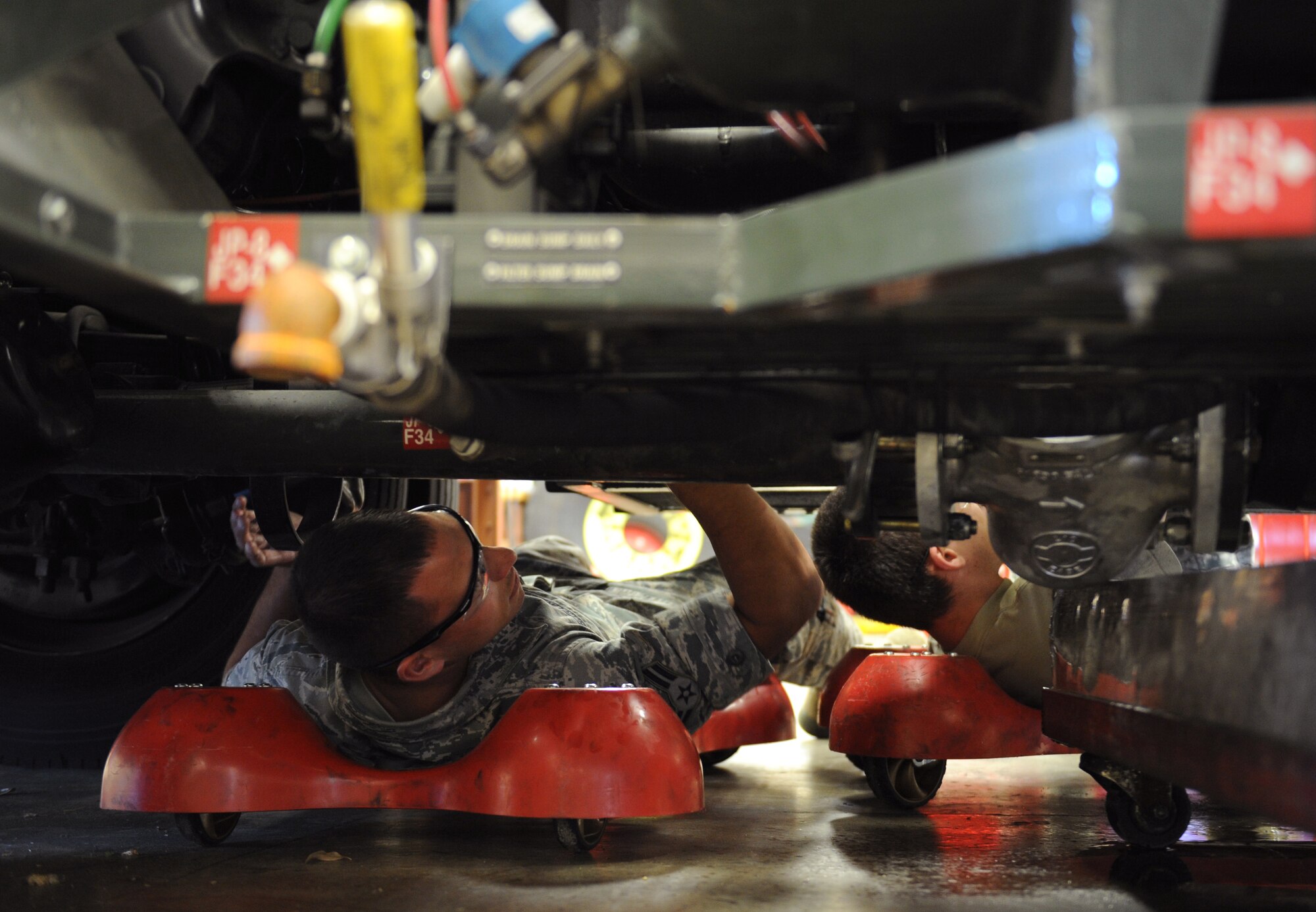 Airman 1st Class Freddie Martinez, 2nd Logistics Readiness Squadron Firetruck and Refueling Maintenance Section, inspects underneath an R-12 refueling truck on Barksdale Air Force Base, La., March 20. Fire and refueling trucks have unique systems, which require Airmen to have in-depth knowledge on how to maintain them. (U.S. Air Force photo/Airman 1st Class Benjamin Gonsier)