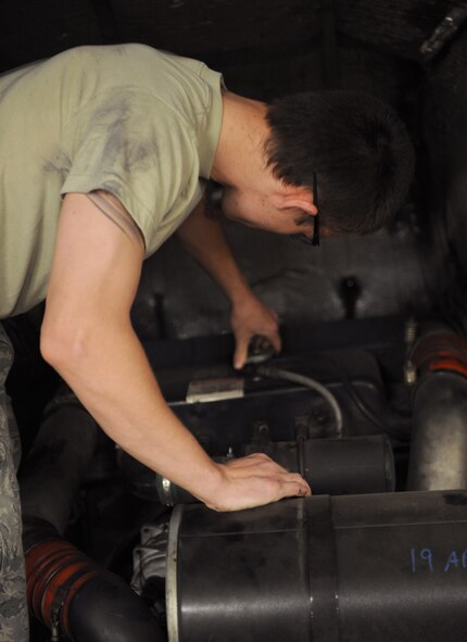 Airman 1st Class Timothy Bailey, 2nd Logistics Readiness Squadron Firetruck and Refueling Maintenance Section, removes a radiator cap from a P-22 firetruck on Barksdale Air Force Base, La., March 20. The radiator circulates coolant throughout the vehicle to prevent overheating. (U.S. Air Force photo/Airman 1st Class Benjamin Gonsier)