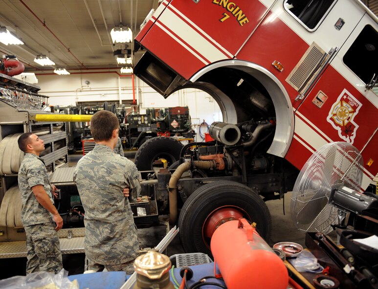 Airmen from the 2nd Logistics Readiness Squadron Firetruck and Refueling Maintenance Section raise the cab of a P-22 firetruck on Barksdale Air Force Base, La., March 20. Fire and refueling trucks have unique systems, which require Airmen to have in-depth knowledge on how to maintain them. (U.S. Air Force photo/Airman 1st Class Benjamin Gonsier)