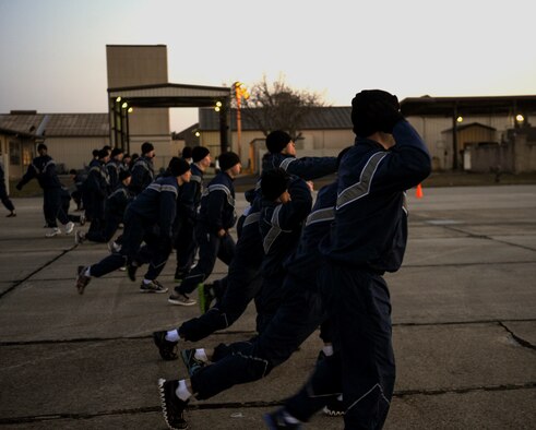 U.S. Air Force Airmen from the 820th Base Defense Group perform lunges during a physical training session for the group’s 16th birthday at Moody Air Force Base, Ga., March 15, 2013. The 820th BDG is a quick-reaction force established in 1997 whose home-station mission is to prepare to able to deploy at a moment’s notice. (U.S. Air Force photo by Airman 1st Class Olivia Bumpers/Released)