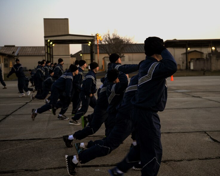 U.S. Air Force Airmen from the 820th Base Defense Group perform lunges during a physical training session for the group’s 16th birthday at Moody Air Force Base, Ga., March 15, 2013. The 820th BDG is a quick-reaction force established in 1997 whose home-station mission is to prepare to able to deploy at a moment’s notice. (U.S. Air Force photo by Airman 1st Class Olivia Bumpers/Released)