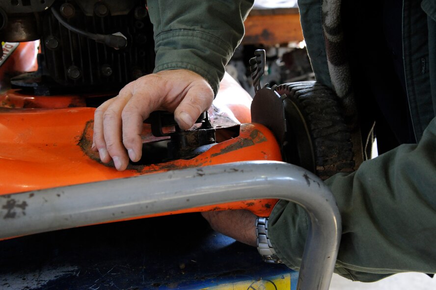Robert Ford, 2nd Force Support Squadron Equipment Rental maintenance supervisor, repairs a lawnmower on Barksdale Air Force Base, La., March 20. Equipment rental offers Airmen the opportunity to rent camping gear, fishing and boating supplies and purchase firewood. (U.S. Air Force photo/Airman 1st Class Andrew Moua)