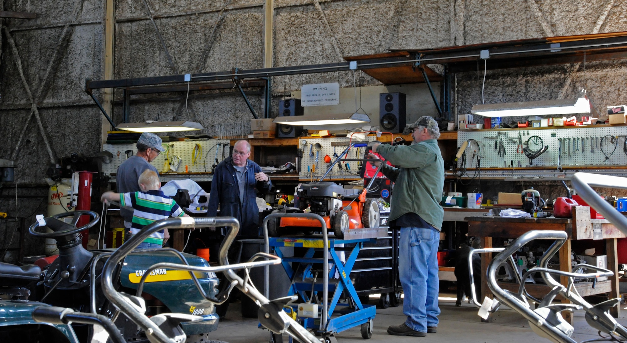 Workers assigned to the 2nd Force Support Squadron Equipment Rental repair equipment on Barksdale Air Force Base, La., March 20. Equipment Rental lends out and maintains equipment for Team Barksdale to use ranging from campers, grills, boats and trailers as well as offering lawn mower repair. (U.S. Air Force photo/Airman 1st Class Andrew Moua)