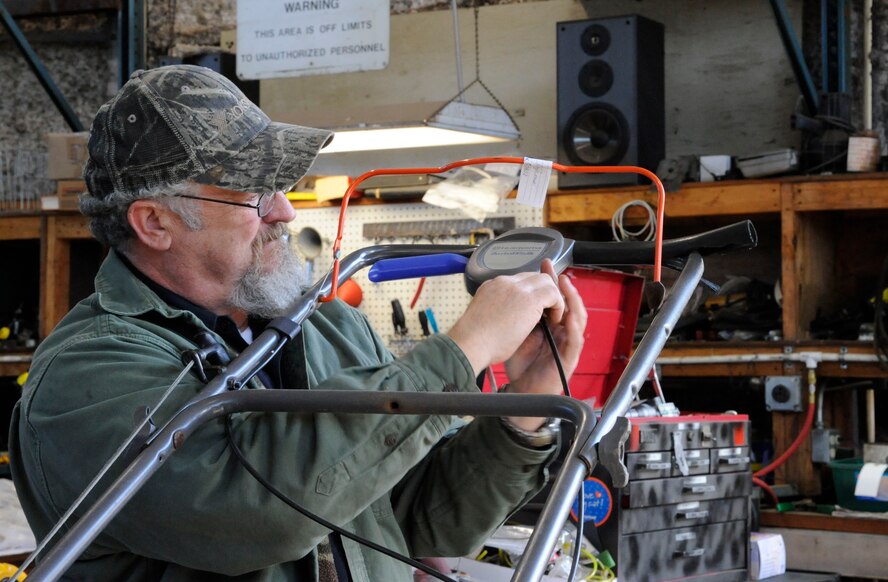 Robert Ford, 2nd Force Support Squadron Equipment Rental maintenance supervisor, repairs a lawnmower on Barksdale Air Force Base, La., March 20. Equipment Rental lends out and maintains equipment for Team Barksdale to use ranging from campers, grills, boats and trailers as well as offering lawn mower repair. (U.S. Air Force photo/Airman 1st Class Andrew Moua)