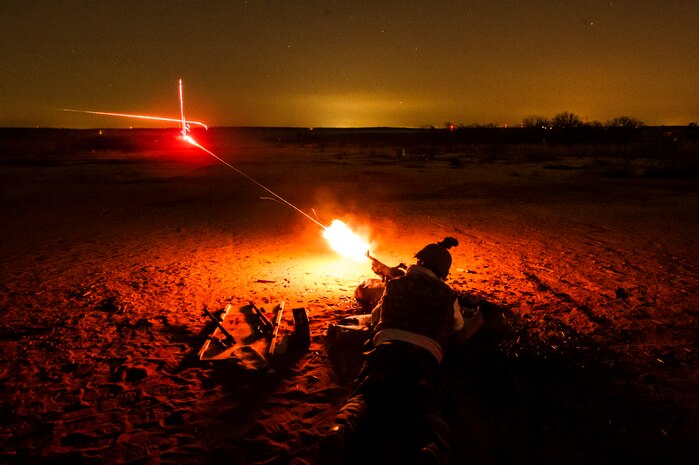 A member of the 628th Security Forces Squadron fires a M240B machine gun during a weapons familiarization and proficiency training course March 14, 2013, at Ft. Jackson, S.C. The 628th SFS performed the training for M240B proficiency for use on patrol boats on the Cooper River and surrounding area. (U.S. Air Force photo/ Senior Airman George Goslin)