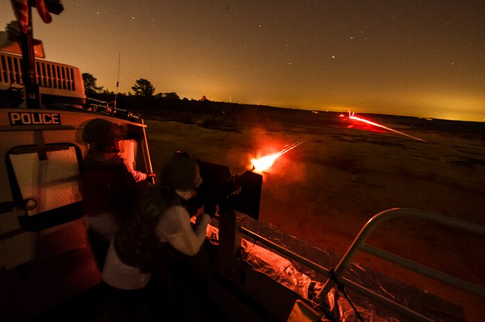 A member of the 628th Security Forces Squadron fires a M240B machine gun during a weapons familiarization and proficiency training course March 14, 2013, at Ft. Jackson, S.C. The 628th SFS performed the training for M240B proficiency for use on patrol boats on the Cooper River and surrounding area. (U.S. Air Force photo/ Senior Airman George Goslin)
