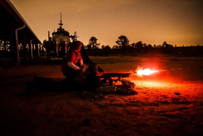 A member of the 628th Security Forces Squadron fires a M240B machine gun during a weapons familiarization and proficiency training course March 14, 2013, at Ft. Jackson, S.C. The 628th SFS performed the training for M240B proficiency for use on patrol boats on the Cooper River and surrounding area. (U.S. Air Force photo/ Senior Airman George Goslin)