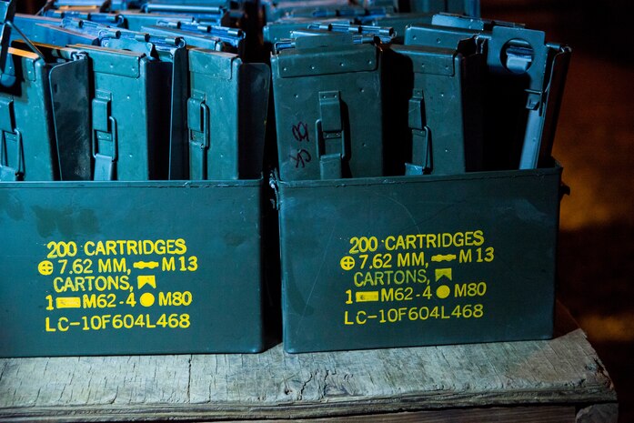 Empty ammunition cans are lined up for cleanup after a weapons familiarization and proficiency training course March 14, 2013, at Ft. Jackson, S.C. The 628th SFS performed the training for M240B proficiency for use on patrol boats on the Cooper River and surrounding area. (U.S. Air Force photo/ Senior Airman George Goslin)
