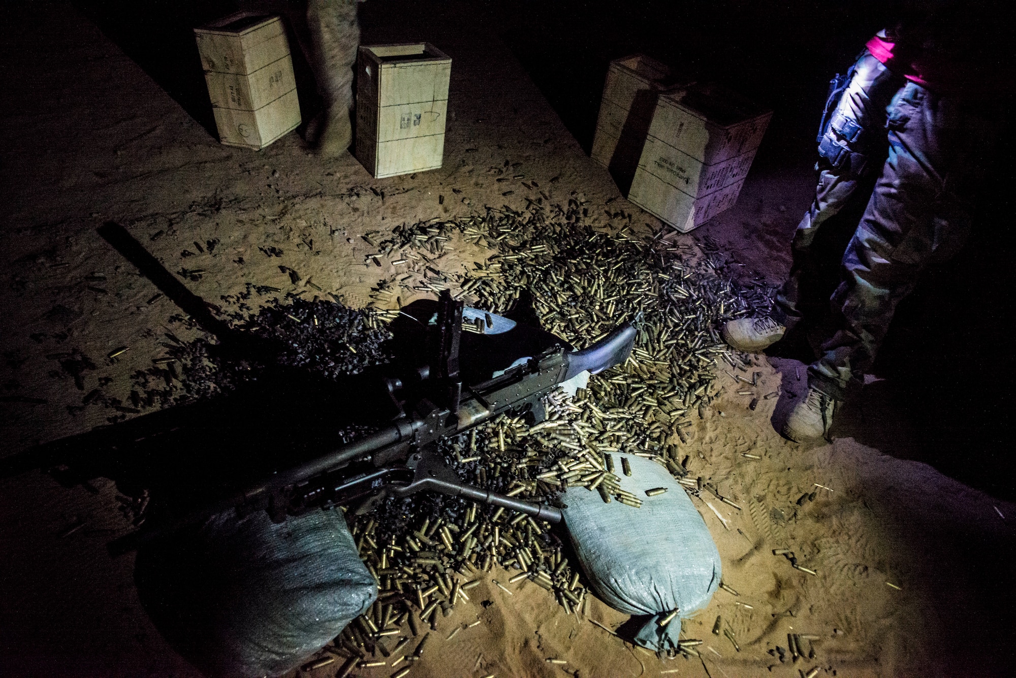 Thousands of shell casings lie around a M240B machine gun after a weapons familiarization and proficiency training course March 14, 2013, at Ft. Jackson, S.C. The 628th SFS performed the training for M240B proficiency for use on patrol boats on the Cooper River and surrounding area. (U.S. Air Force photo/ Senior Airman George Goslin)