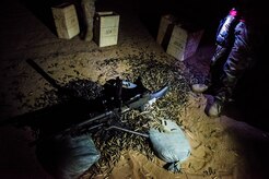 Thousands of shell casings lie around a M240B machine gun after a weapons familiarization and proficiency training course March 14, 2013, at Fort Jackson, S.C. The 628th SFS performed the training for M240B proficiency for use on patrol boats on the Cooper River and surrounding waterways. (U.S. Air Force photo/Senior Airman George Goslin) 

